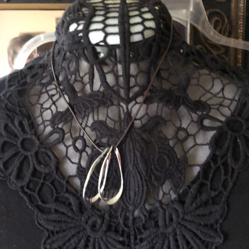 Brown cord necklace with two silver hoops